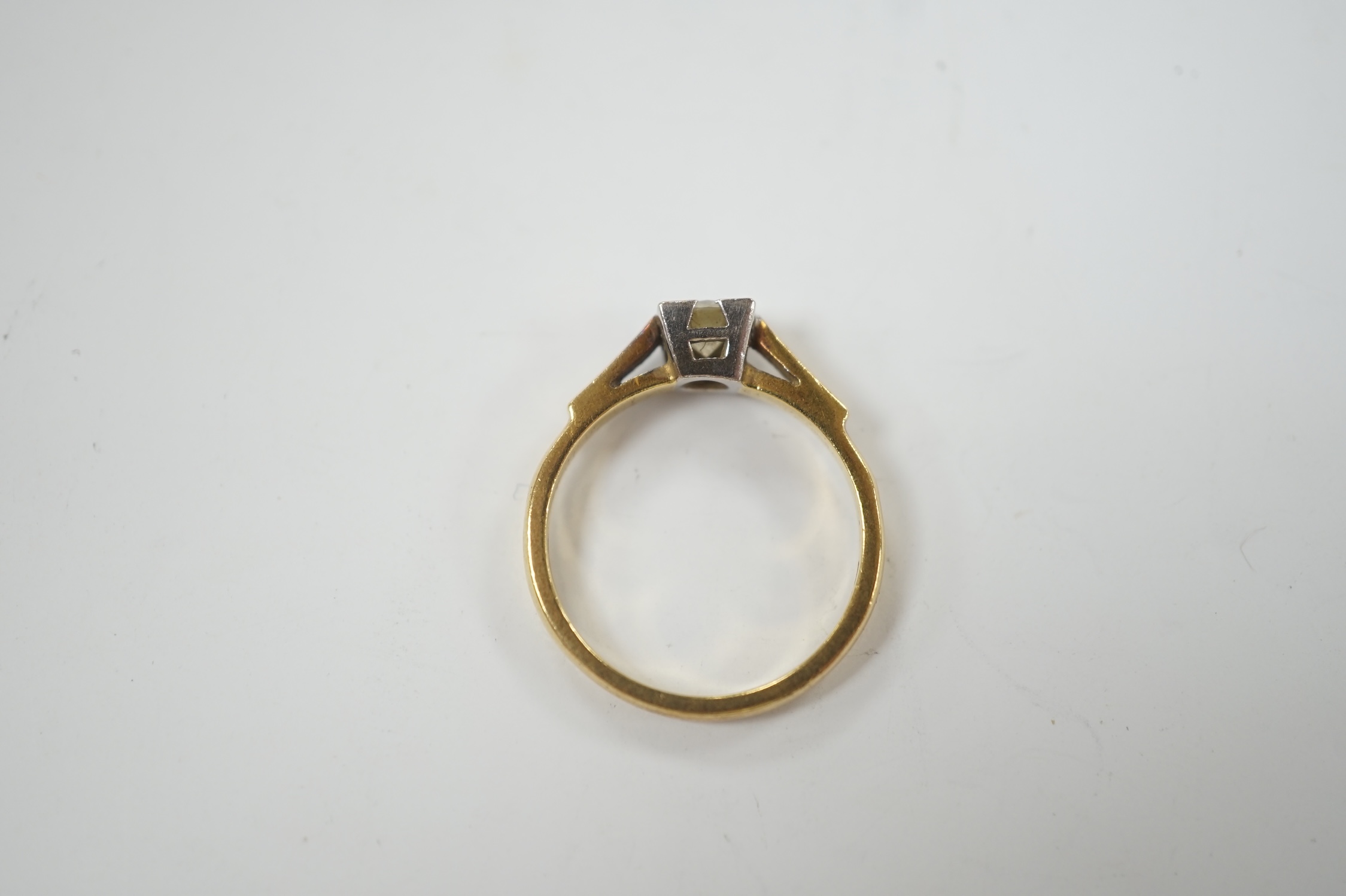 A modern 18ct gold and solitaire diamond set ring, size N, gross weight 3.6 grams.